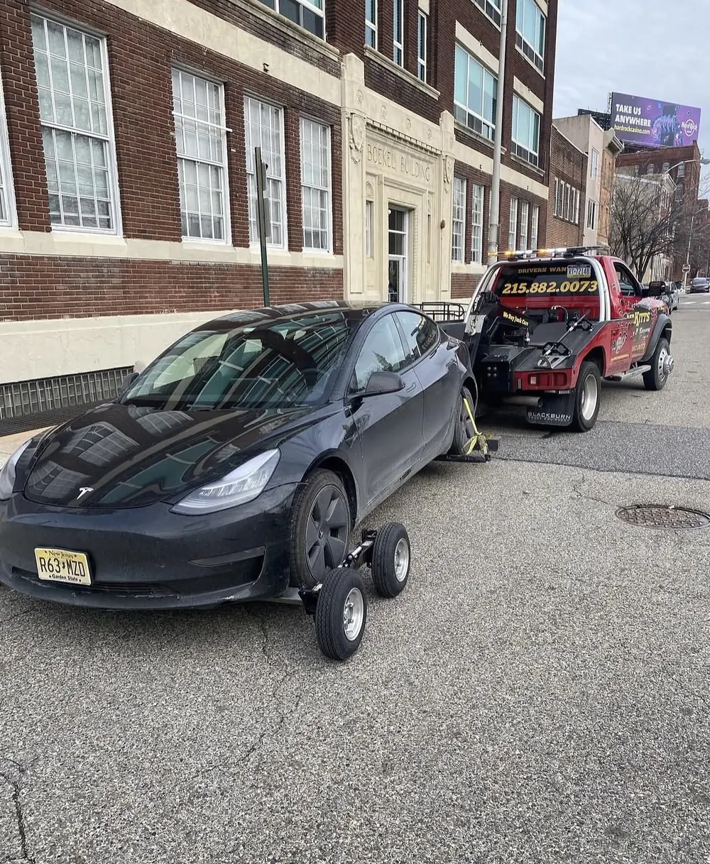 An electric vehicle loaded onto a flatbed