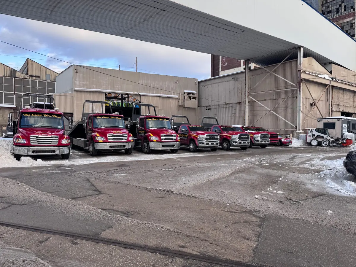 Mr. Kitt's tow trucks staged under an overpass in Philadelphia