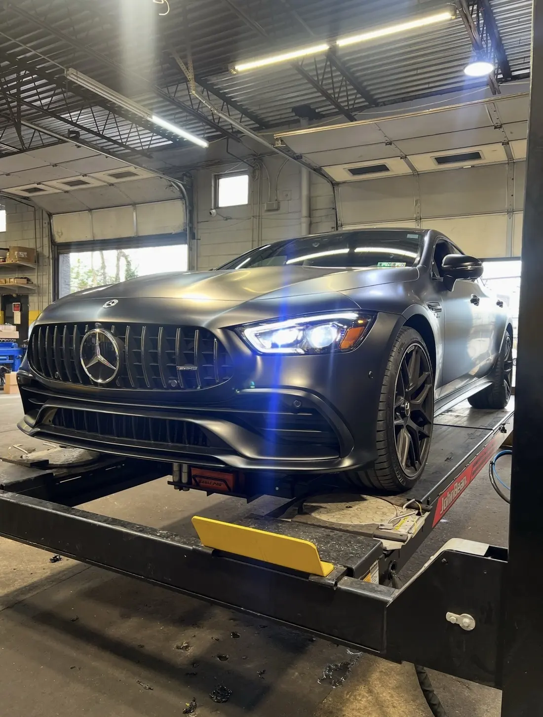 A Mercedes-AMG GT on the four-wheel alignment rack at Mr. Kitt's