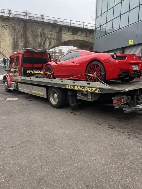 A Ferrari secured on a Mr. Kitt's flatbed