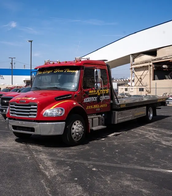 A Mr. Kitt's flatbed with a clear deck waiting at the yard