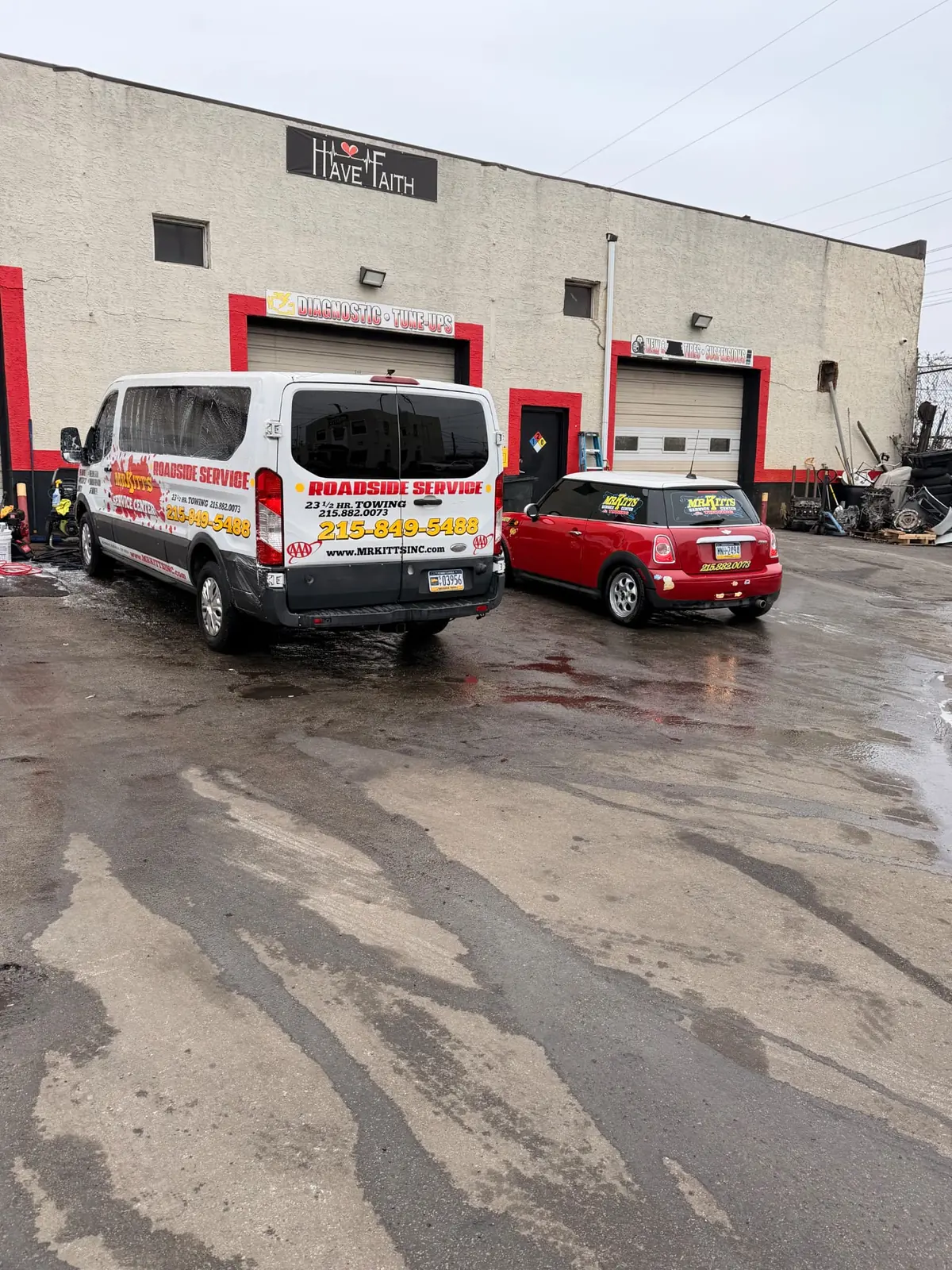 Mr. Kitt's trucks and service van at the shop